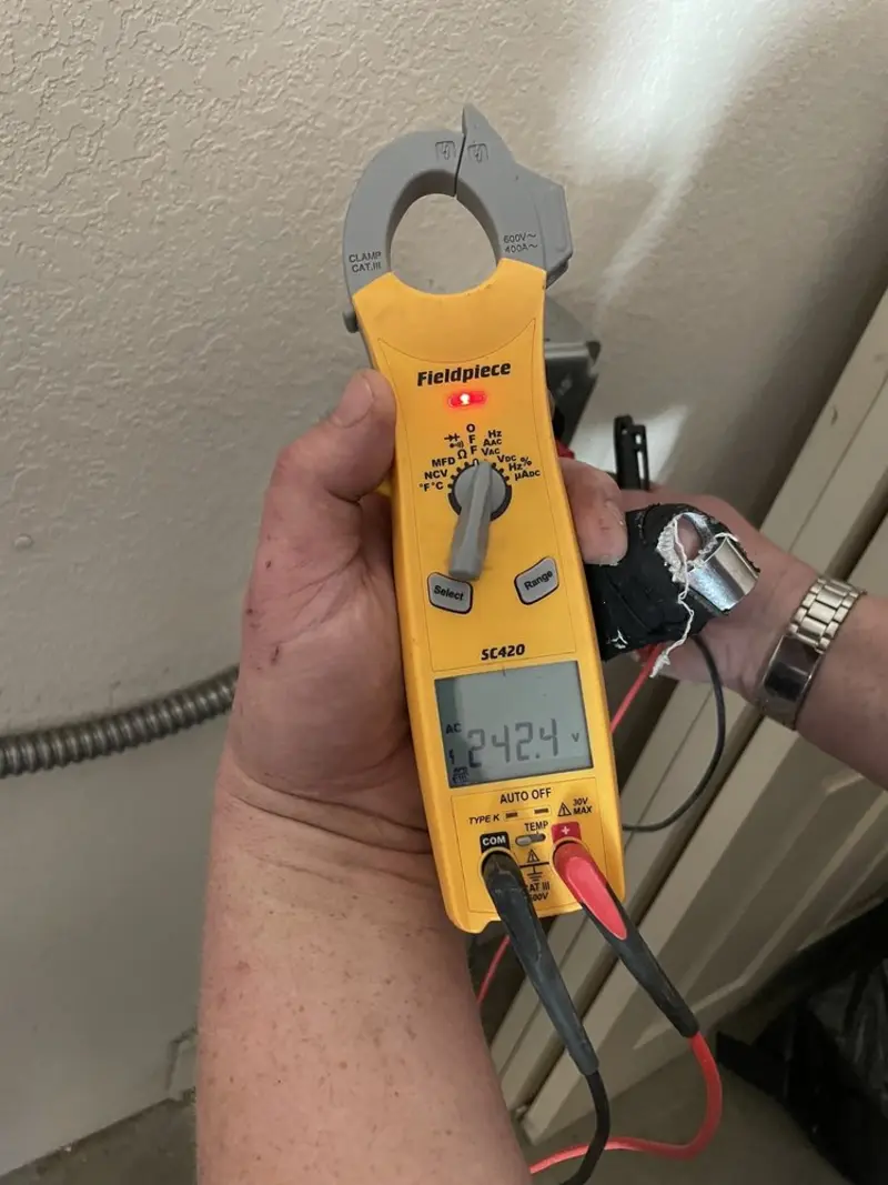 Voltage testing with clamp meter during Ceiling Fan Installation in East Earl